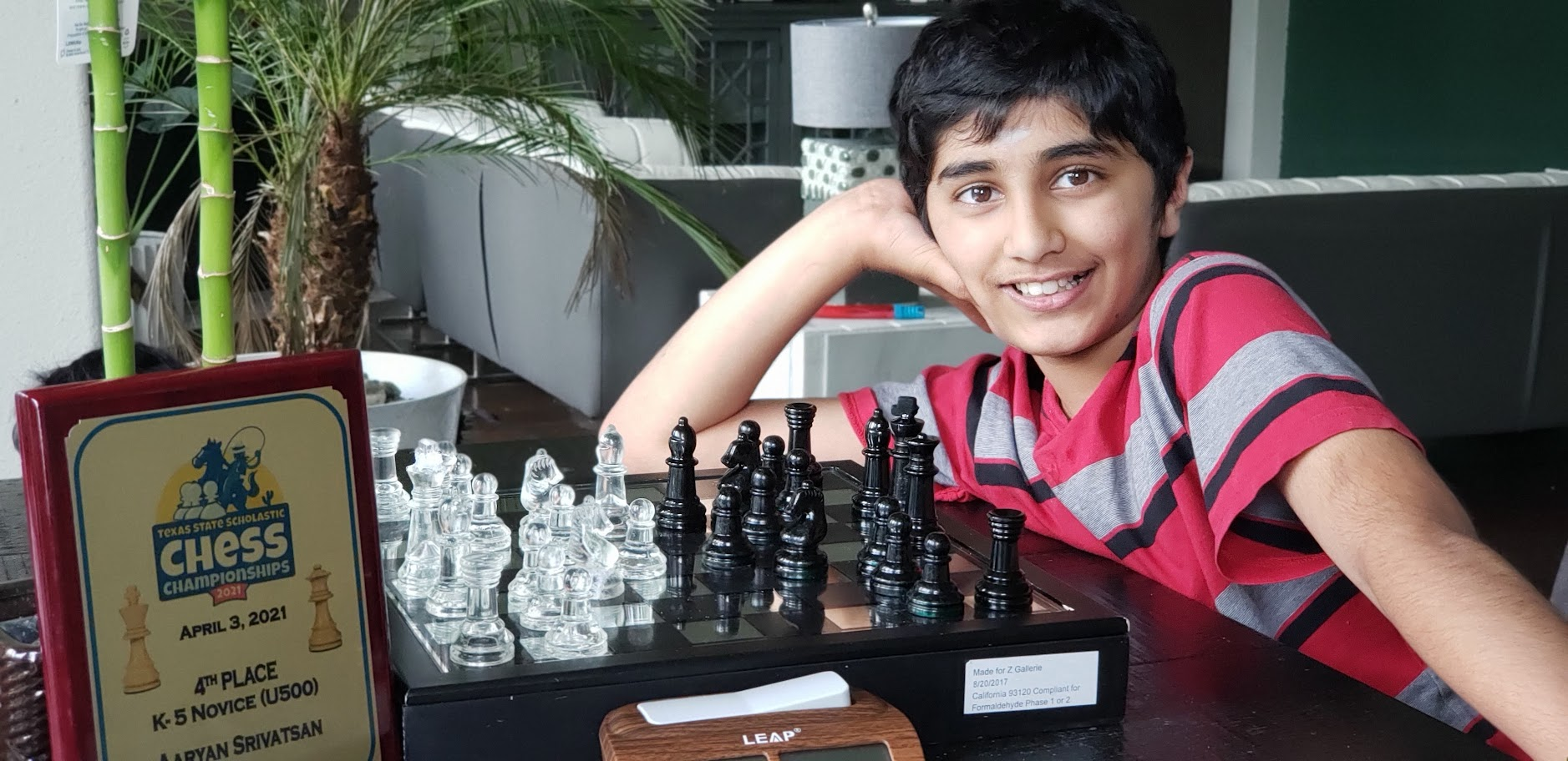 Aaryan with his Texas State Scholastic Chess trophy