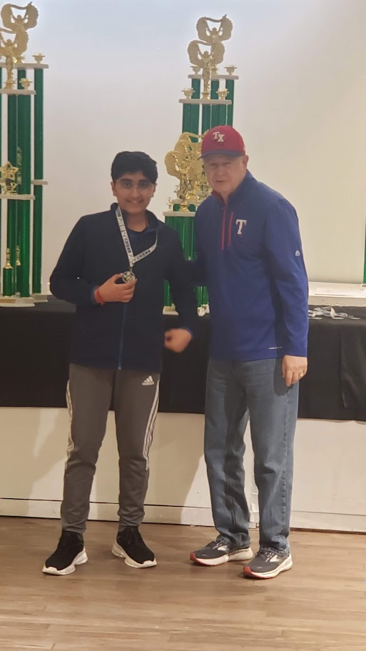 Aaryan receiving a chess medal